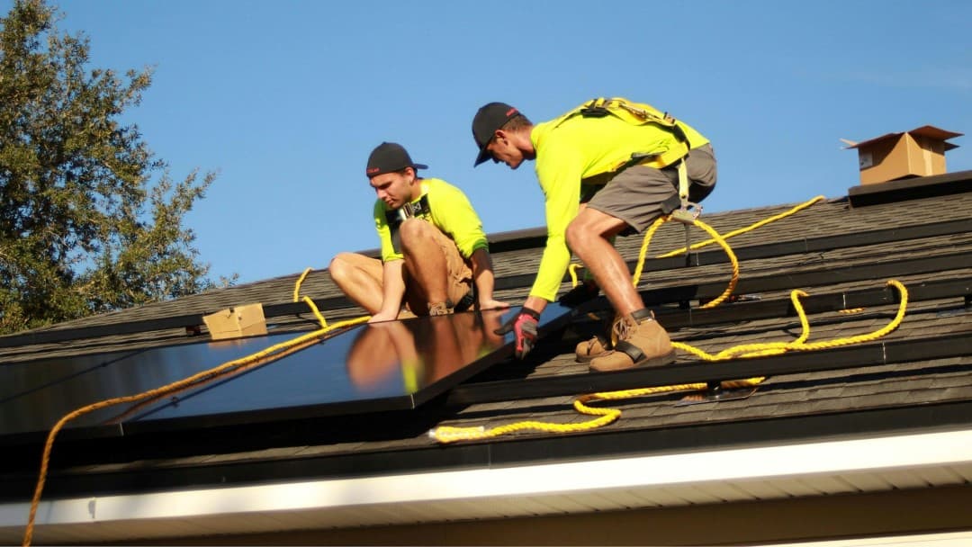 Solar technician on rooftop